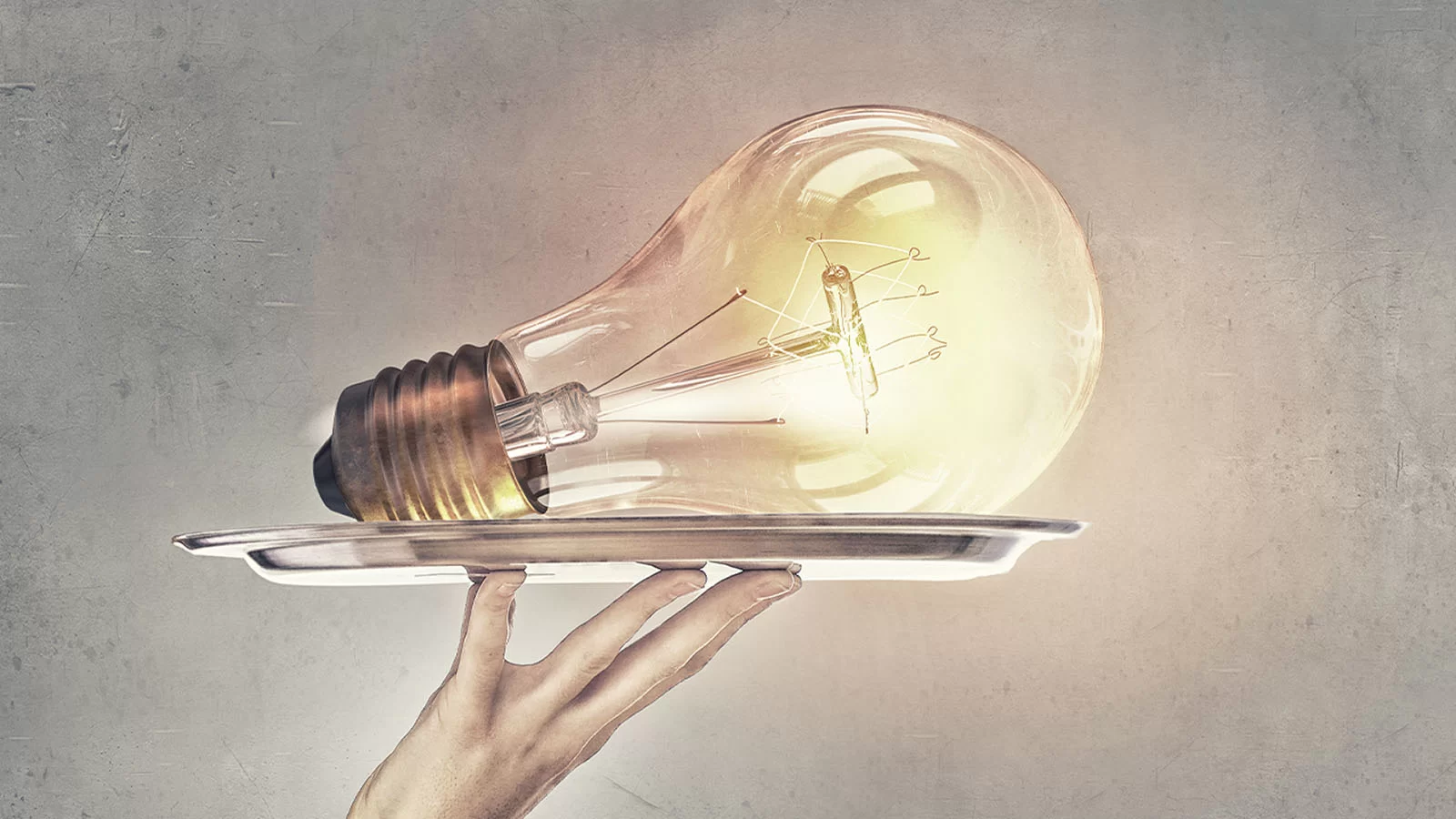 A lit lightbulb resting on a foodservice tray