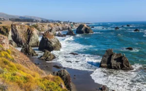 Beach with large rocks on the shore and into the water