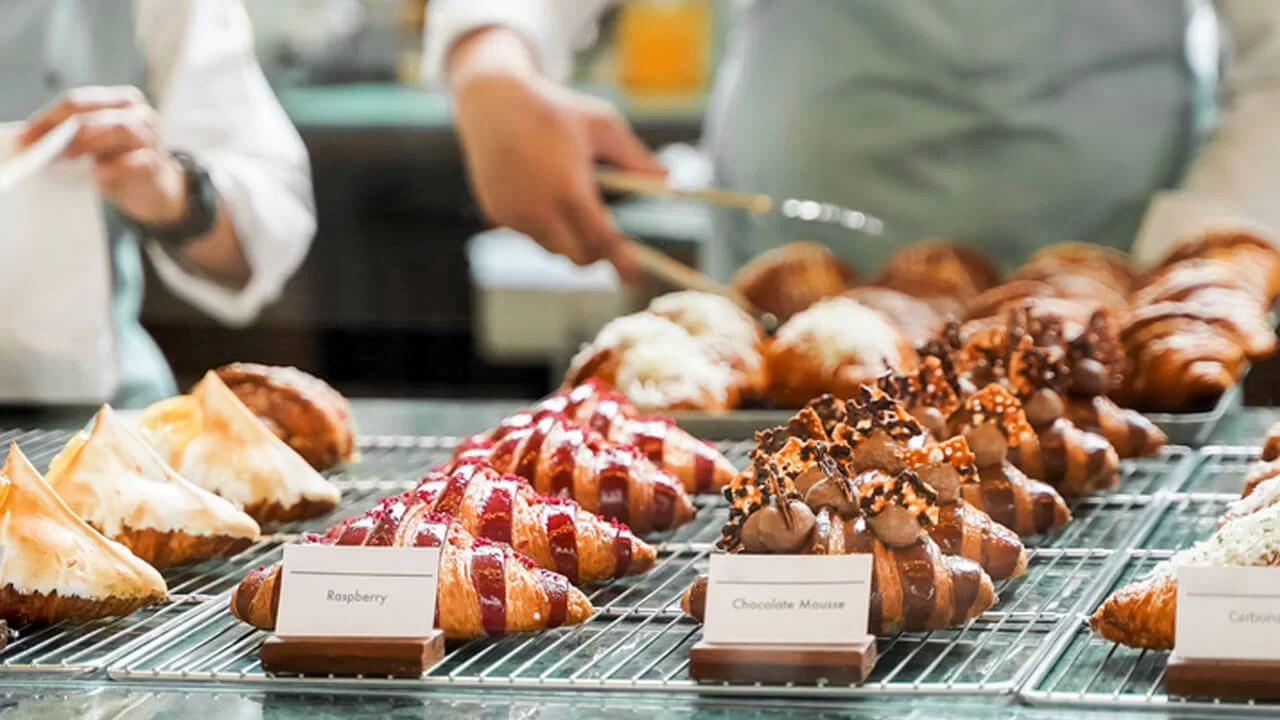 Rows of various types of croissants