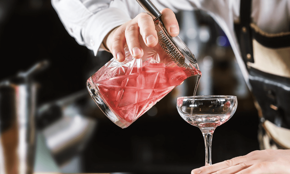 Bartender pouring a cocktail