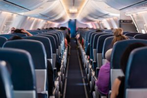 photo of down the aisle of an aircraft